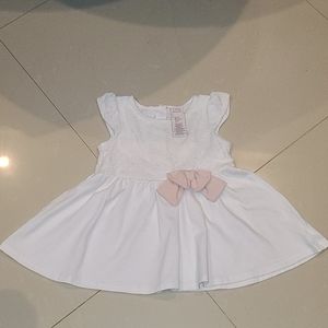 White blouse pink bow accent